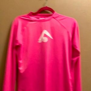 Pink active wear. Brand new never worn. Just not my color.